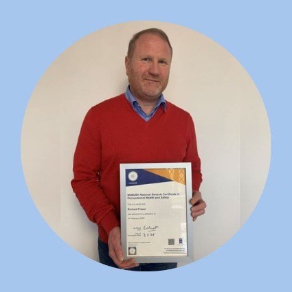 Rich Fraser proudly displays his NEBOSH general certificate